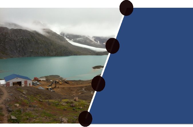 Photograph taken overlooking Brucejack Lake. Structures and equipment related to the Brucejack Gold Mine Project appear in the foreground and Knipple Glacier appears in the background.
